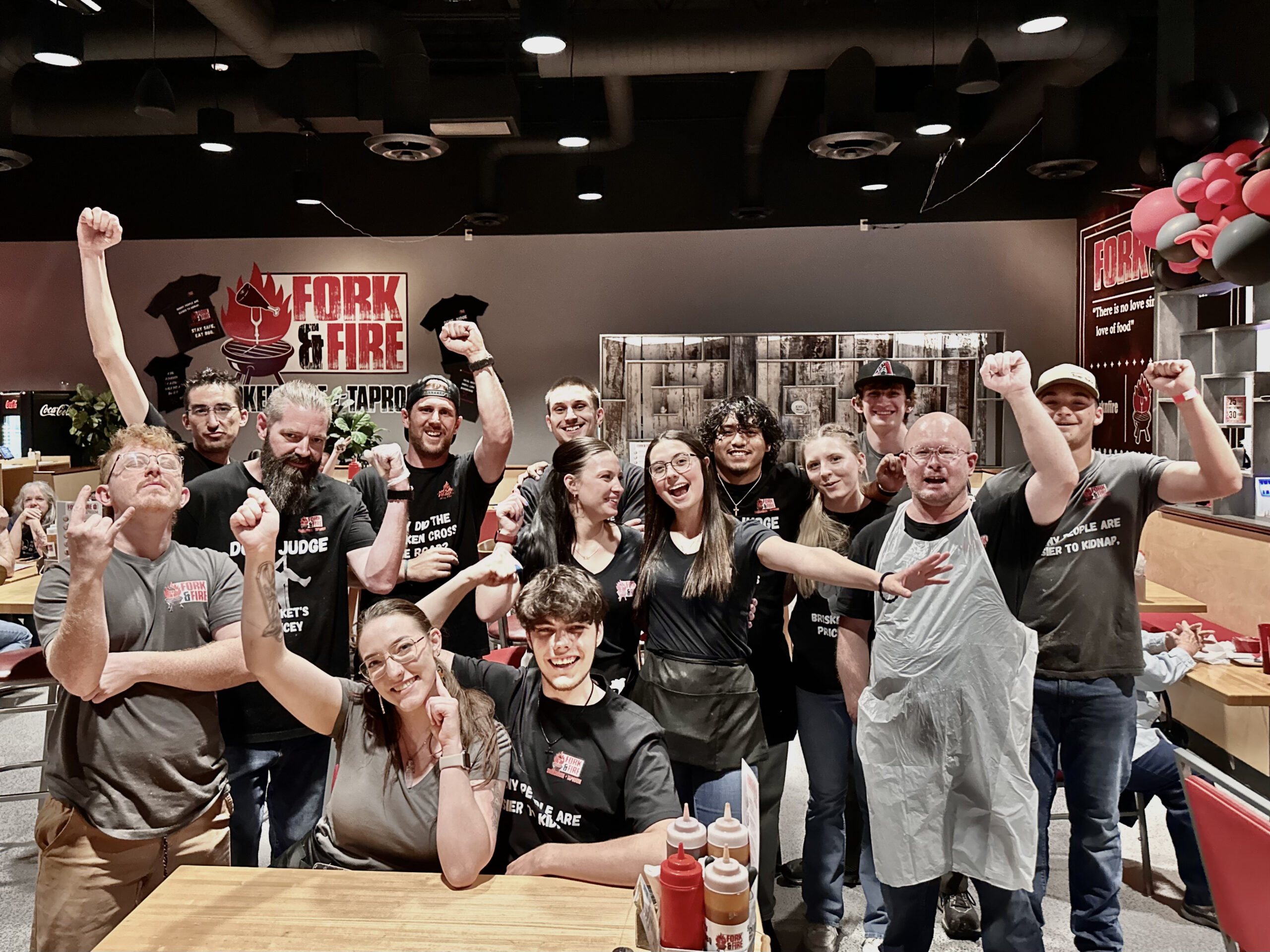 Team photo of celebration at Fork & Fire restaurant.